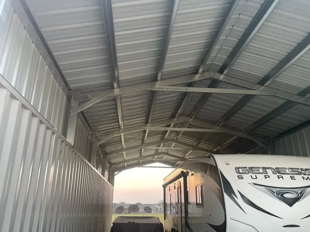 Steel arch RV cover building with metal roof panels.